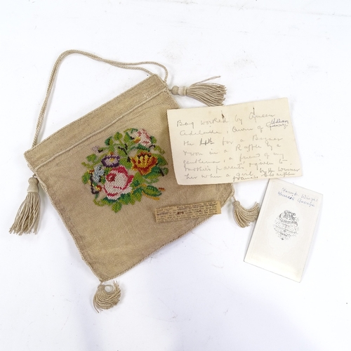 110 - ROYAL INTEREST - a floral cross-stitch embroidered evening bag, together with a hand written note st... 