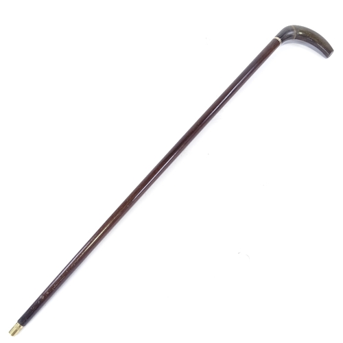 121 - A horn walking cane with silver collar and hardwood shaft