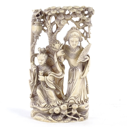 131 - A late 19th/early 20th century Chinese ivory carving, two women with lotus flower, height 20cm.