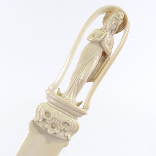 135 - A Chinese ivory paper knife with relief carved handle in the form of a deity, length 30cm, and a pla... 