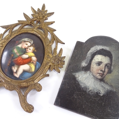 57 - A 19th century painted porcelain plaque, depicting a woman and child in carved giltwood frame, heigh... 