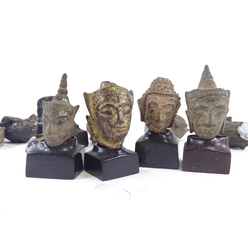 59 - 10 miniature cast bronze Thai Buddha heads, with later made hardwood stands, tallest 6cm with stand.