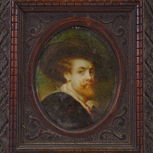 62 - A 19th century miniature painted portrait on ivory, depicting a man wearing a wide brimmed hat, unsi... 