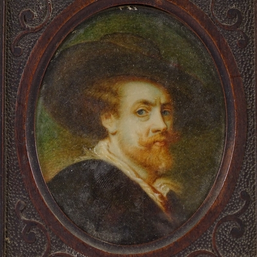 62 - A 19th century miniature painted portrait on ivory, depicting a man wearing a wide brimmed hat, unsi... 