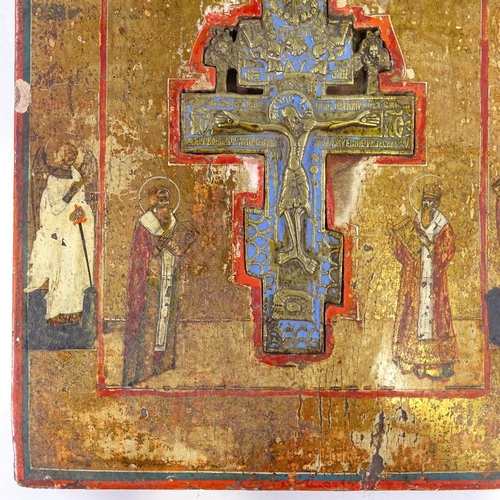 65 - A 19th century Russian relief cast brass and enamel icon crucifix, set in painted and gilded icon wo... 