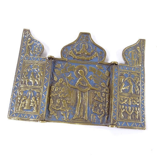 67 - A Russian relief cast bronze triptych icon with blue enamel decoration, height 10cm