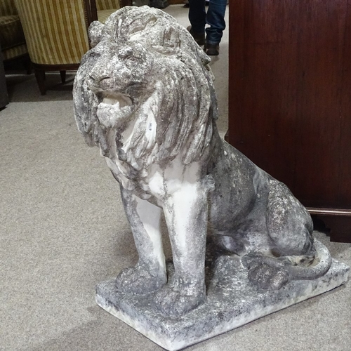 115 - A large-scale weathered concrete garden statue of a lion, overall height 94cm