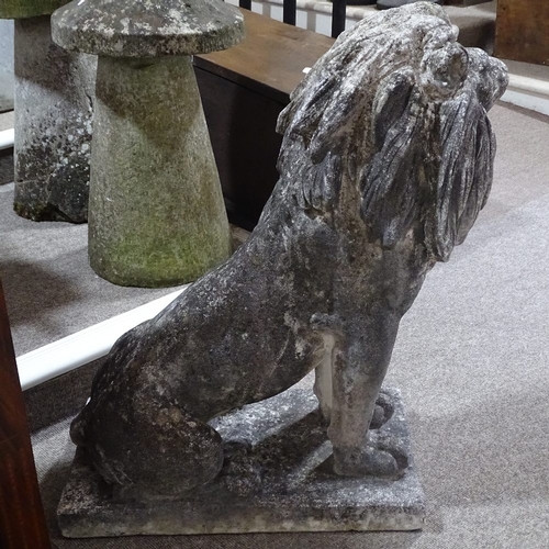 115 - A large-scale weathered concrete garden statue of a lion, overall height 94cm