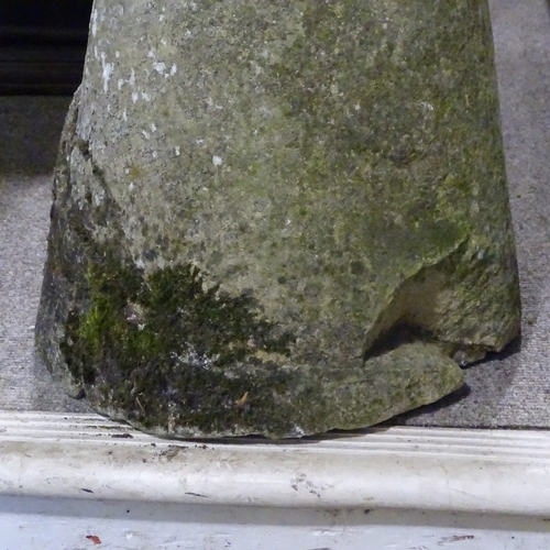 116 - A weathered stone saddle stone, height 74cm, diameter 41cm