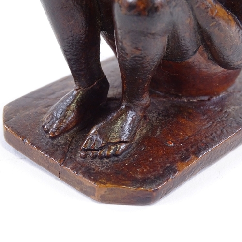 120 - An Indian 19th century wood carving of a seated man, height 9.5cm