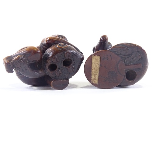 17 - 2 hardwood netsuke of a dog and a man with beaver, tallest 4cm