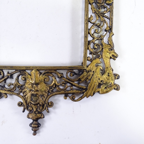 1237 - A 19th century cast and pierced gilt-brass frame, inside measurements 9