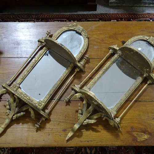 72 - A pair of 19th century gilt-gesso framed wall brackets with mirror backs, height 78cm