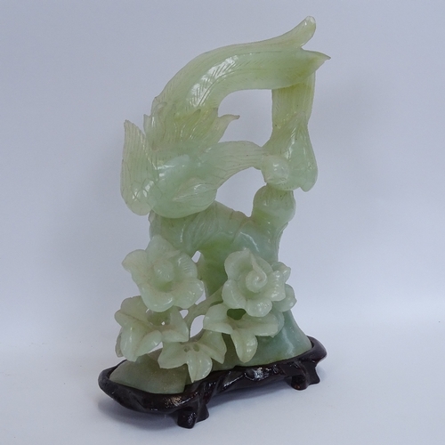 10 - A collection of various Oriental soapstone and jadeite carvings, including water buffalo, and birds-... 