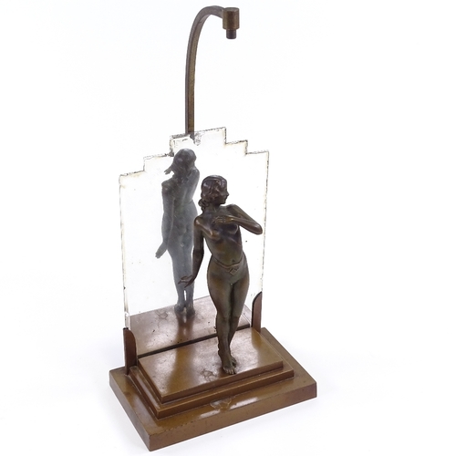12 - Art Deco bronze patinated spelter table lamp in the form of a naked dancer, unsigned, on stepped gil... 