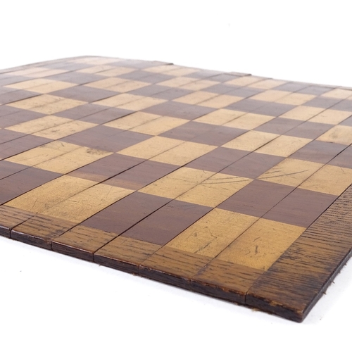 178 - A 19th century mahogany and boxwood roll-up travelling games board, 39cm across