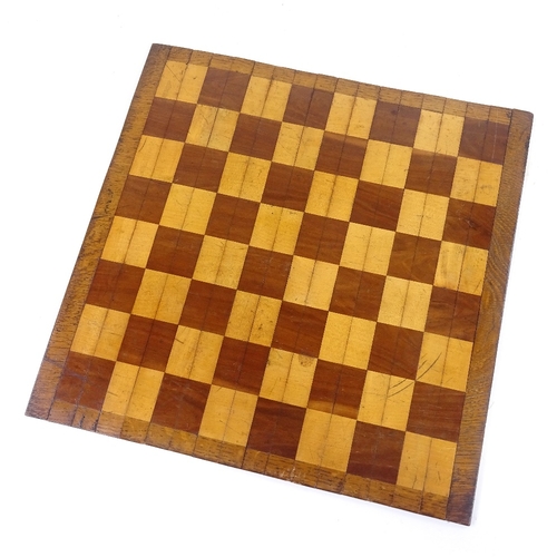 178 - A 19th century mahogany and boxwood roll-up travelling games board, 39cm across