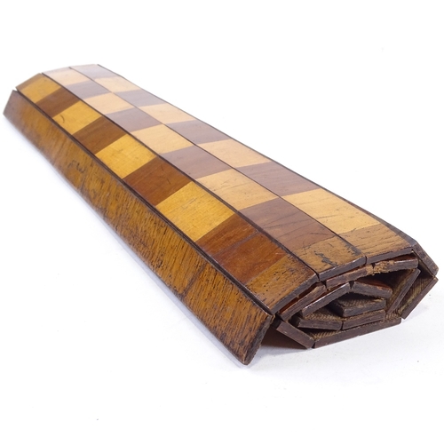 178 - A 19th century mahogany and boxwood roll-up travelling games board, 39cm across