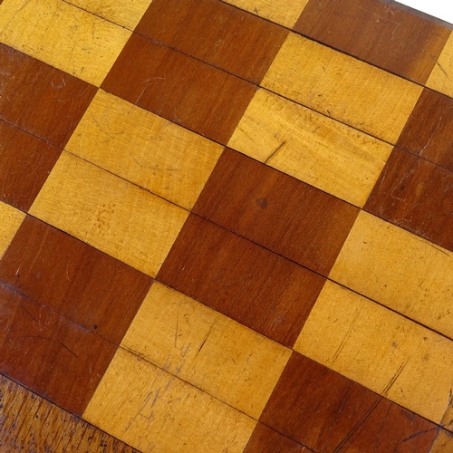 178 - A 19th century mahogany and boxwood roll-up travelling games board, 39cm across