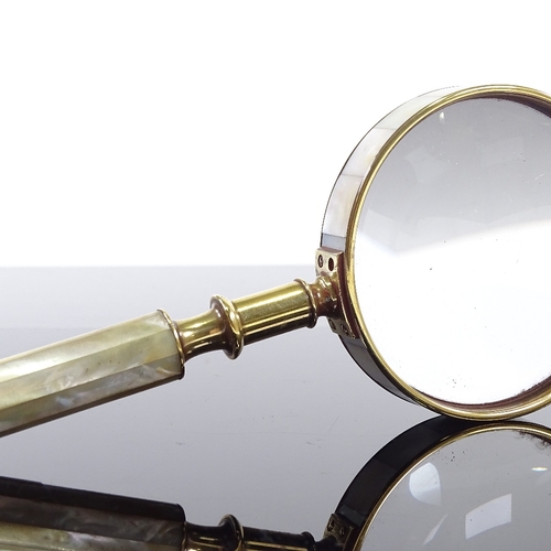 179 - A mother-of-pearl and brass-mounted magnifying glass, length 21cm