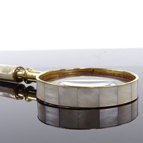 179 - A mother-of-pearl and brass-mounted magnifying glass, length 21cm