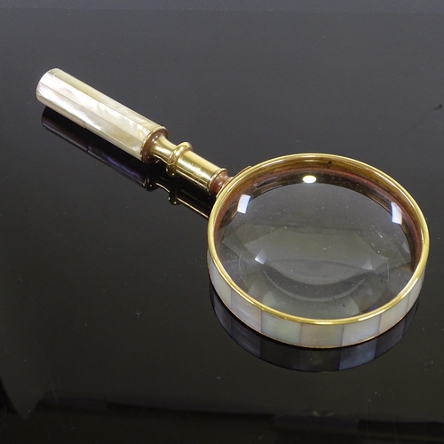 179 - A mother-of-pearl and brass-mounted magnifying glass, length 21cm