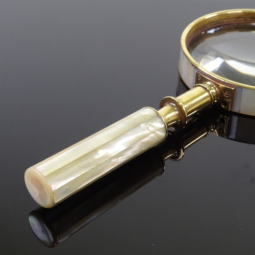 179 - A mother-of-pearl and brass-mounted magnifying glass, length 21cm