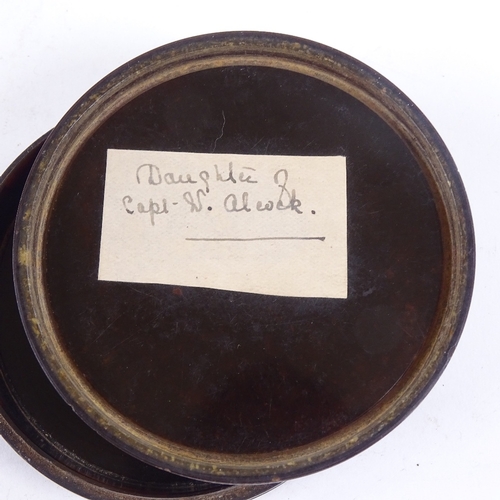 180 - A fine early 19th century circular lacquer box with painted crosshatch design, the lid having an ins... 