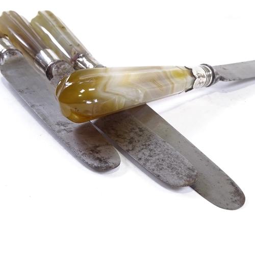 182 - A set of 4 early 19th century carved agate-handled knives, with silver armorial collars, by Verinder... 