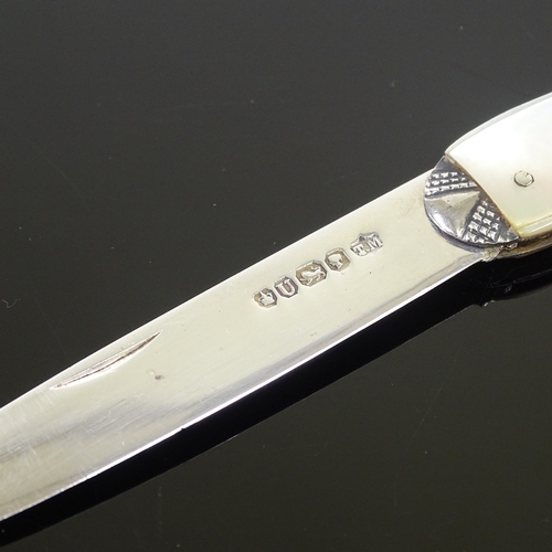 184 - A Victorian carved mother-of-pearl and silver fruit knife, hallmarks Sheffield 1862, length closed 9... 