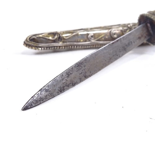 198 - A Middle Eastern white metal cased dagger, with filigree decoration, length 28cm.