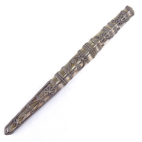 198 - A Middle Eastern white metal cased dagger, with filigree decoration, length 28cm.