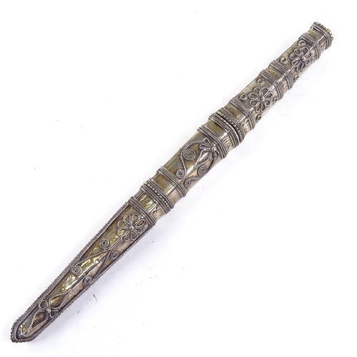 198 - A Middle Eastern white metal cased dagger, with filigree decoration, length 28cm.