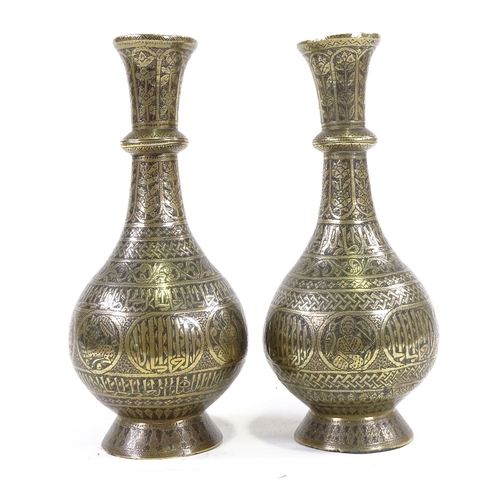 204 - A pair of heavy gauge Middle Eastern bronze narrow-necked vases, with engraved decoration, height 30... 