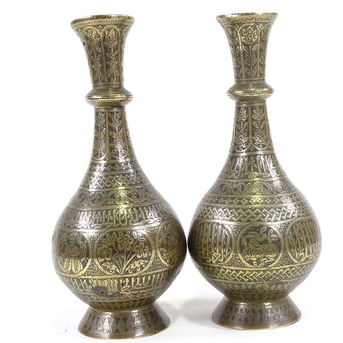 204 - A pair of heavy gauge Middle Eastern bronze narrow-necked vases, with engraved decoration, height 30... 