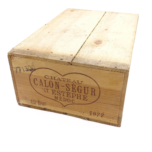 21 - 12 bottles of 1977 Chateau Calon Segur, St Estephe, Medoc wine, in own wooden case.