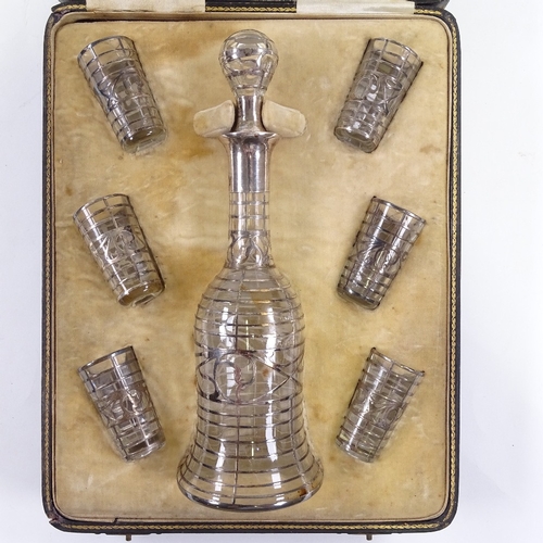 67 - An Edwardian silver overlay glass liqueur set in original fitted case, retailed by Weir & Sons, deca... 