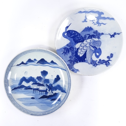 70 - A Japanese blue and white porcelain charger, with hand painted lake scene, diameter 31cm, and a blue... 