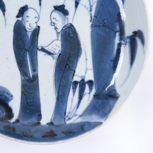 71 - A Japanese blue and white porcelain plate with hand painted figures, 4 character mark, diameter 29cm