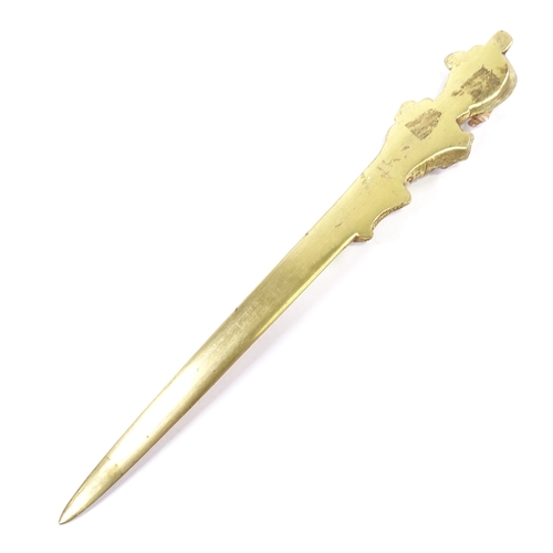 81 - A gilt-bronze and ivory paper knife, the relief cast handle in the form of a Victorian lady, unsigne... 