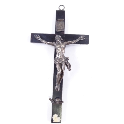 82 - An 18th/19th century Continental silver crucifix on ebonised wood cross, unmarked, height 28cm