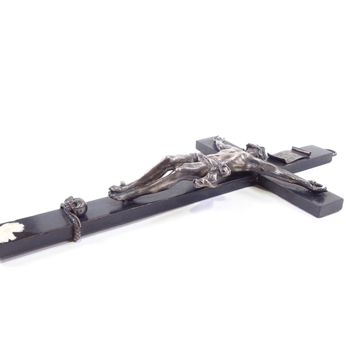 82 - An 18th/19th century Continental silver crucifix on ebonised wood cross, unmarked, height 28cm