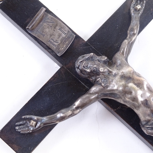 82 - An 18th/19th century Continental silver crucifix on ebonised wood cross, unmarked, height 28cm