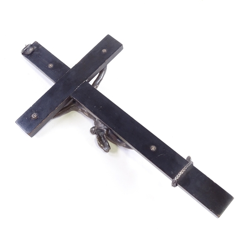 82 - An 18th/19th century Continental silver crucifix on ebonised wood cross, unmarked, height 28cm