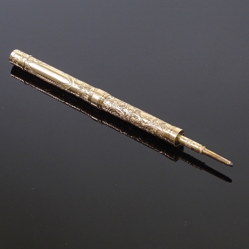 88 - A 9ct gold dual propelling pen/pencil, with engraved decoration, marked 9ct, open pen length 12cm.