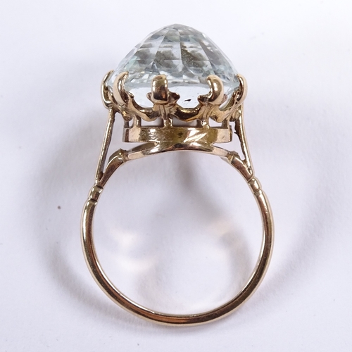 531 - A 9ct gold reverse oval-cut aquamarine dress ring, setting height 17.3mm, size O, 5.5g