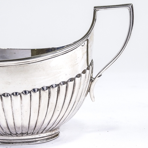 533 - A George V silver 2-handled sugar bowl, half-fluted oval form with reeded border, by Fordham & Faulk... 