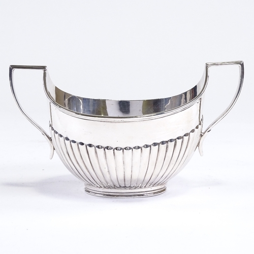 533 - A George V silver 2-handled sugar bowl, half-fluted oval form with reeded border, by Fordham & Faulk... 