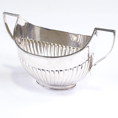 533 - A George V silver 2-handled sugar bowl, half-fluted oval form with reeded border, by Fordham & Faulk... 