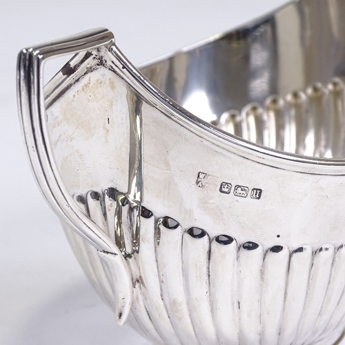 533 - A George V silver 2-handled sugar bowl, half-fluted oval form with reeded border, by Fordham & Faulk... 